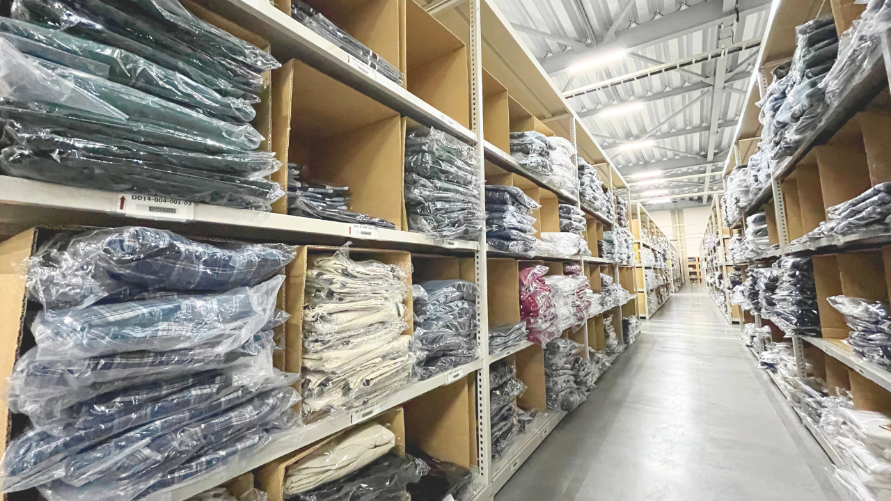Inventory storage in coded bins at an apparel fulfillment warehouse
